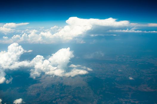 Image of blue sky with white clouds above main land of Greece