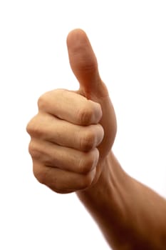 Photographed close up on white man's hand with thumb up shows that all great