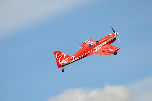 SZYMANOW, POLAND - AUGUST 25: Pilot Piotr Haberland performs acrobatic show in plane Zlin-50 LS on August 25, 2012 in Szymanow.