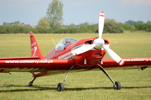 SZYMANOW, POLAND - AUGUST 25: Pilot Piotr Haberland arrives back after acrobatic show in plane Zlin-50 LS on August 25, 2012 in Szymanow.