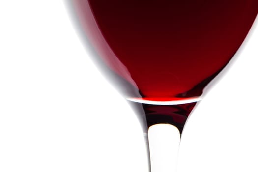 Macro shooting with a glass of red wine on a white background