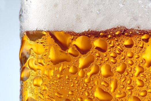 Large drops on glass with a beer glass, macro