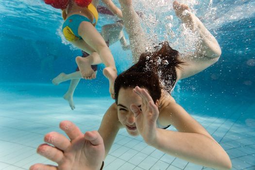 Children swim in the water park and have fun in the water