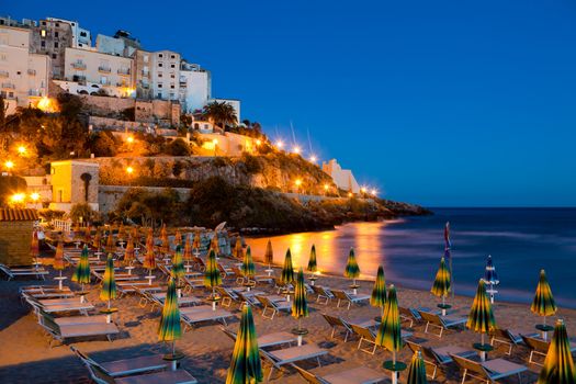 Evening view of the beach and the rock on which the beautiful Italian city of Sperlonga