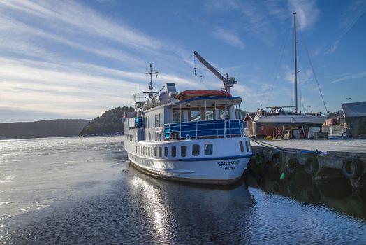 a venerable lady built in 1964 at hjørungavaag workshop, hjørungavaag, norway, the vessel is currently a passenger boat that sails in route between fredrikstad in norway and strömstad in sweden during the summer months, in the winter months are the vessel laid up at halden harbor, the image is shot in february 2013 at halden harbor