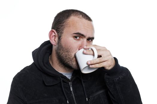 black dressed man drinking tea in a cup