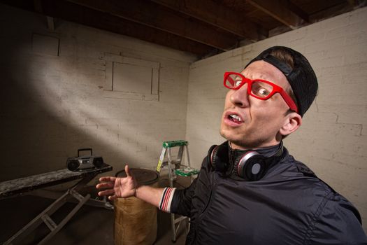 Frustrated man with red eyeglasses
and hat