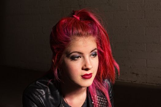 Young punk rocker female with pink hair