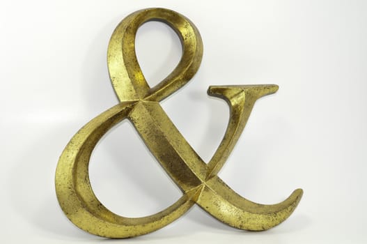 gold antiqued ampersand symbol decoration isolated on white background