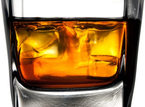 Glass of whiskey - close-up of melting ice cubes