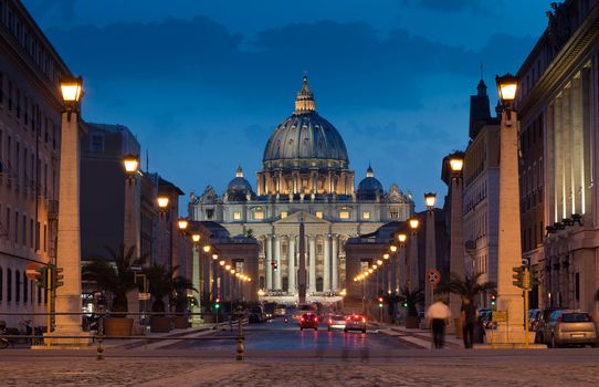 The magnificent evening view of St. Peter's Basilica in Rome by the Via della Conciliazione