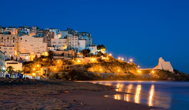 Evening view of the beach and the rock on which the beautiful Italian city of Sperlonga