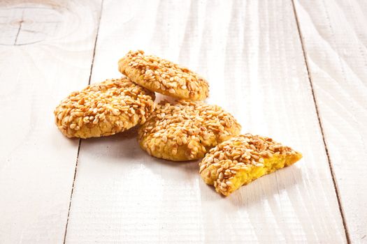 tasty cookies with sesame on the wooden table