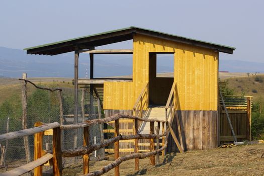 structure for observing or hunting wild animals in a very large enclosure