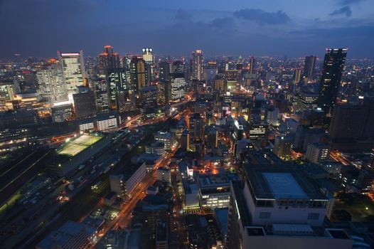 Wide angle picture of urban Osaka at night taken from an elevated viewpoint