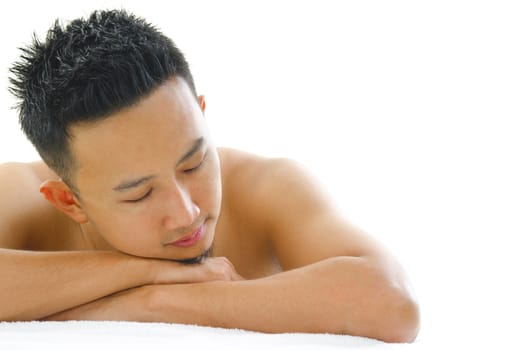 Asian man having a relaxing time in beauty spa