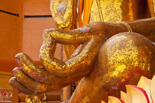 hand of buddha in buddhist temple in kanchanaburi, thailand