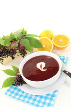 a bowl with Elderberry soup of fresh elderberries
