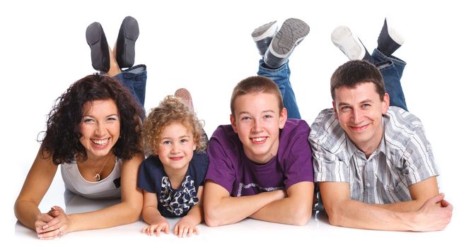 Portrait of happy Caucasian family smiling together on white background