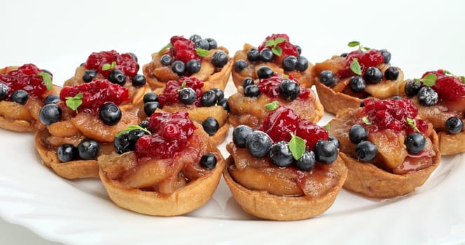 Sweet dessert with apples blueberries and cranberries