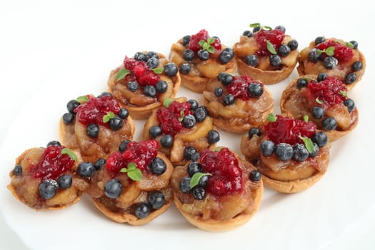 Sweet dessert with apples blueberries and cranberries