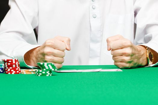 male player at the card table in the casino