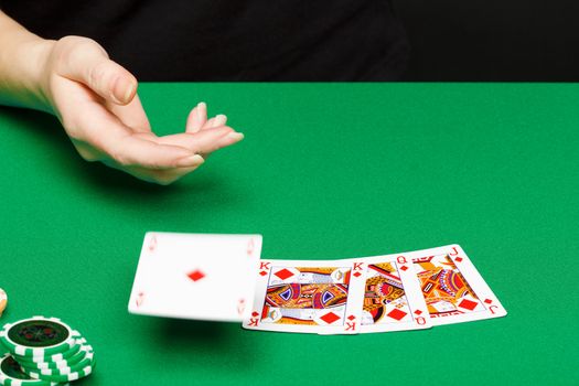 female player at the card table in the casino