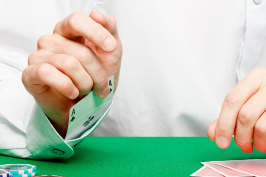 male player at the card table in the casino