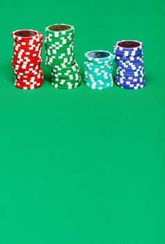 casino chips on the green gaming table