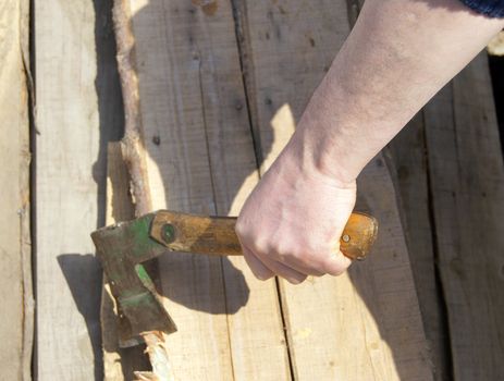 Man's hand with hatchet
