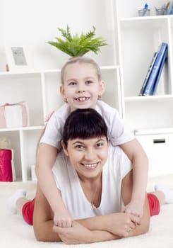 Portrait of happy family lying together, hugging and happy