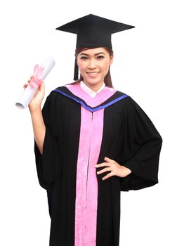 young woman with graduation cap and gown with arm raised holding diploma
