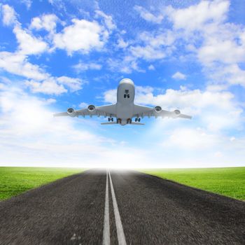 Image of a white flying passenger plane