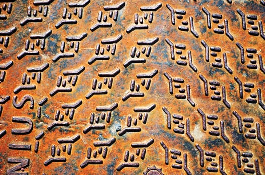 Background of rusty iron steel street well cover lid.