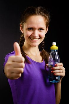 young woman with a bottle of water