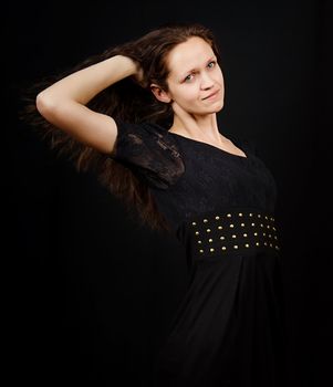 girl with flowing long hair on a black background