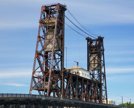 Old rusted Steel Bridge Portland against a hazy blue sky