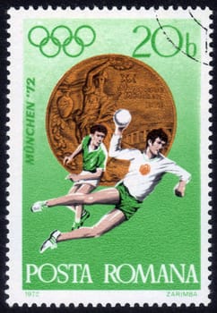 Romania - CIRCA 1972: a stamp printed by Romania, shows the players in handball. Summer Olympic Games in Munich, Germany in 1972, series, circa 1972