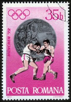 Romania - CIRCA 1972: a stamp printed by Romania, shows fight boxers. Summer Olympic Games in Munich, Germany in 1972, series, circa 1972