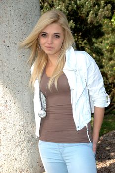 Young female model wears casual clothes. Natural face expression, teenage girl cool and relaxed.