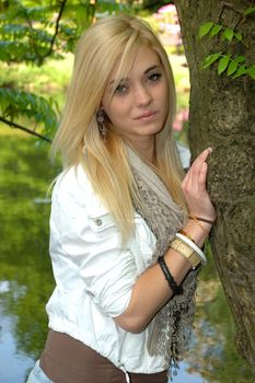 Young female model wears casual clothes. Sits with natural face expression, teenage girl cool and relaxed. 