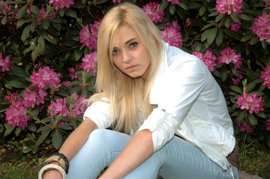 Young female model wears casual clothes. Sits with natural face expression, teenage girl cool and relaxed. 