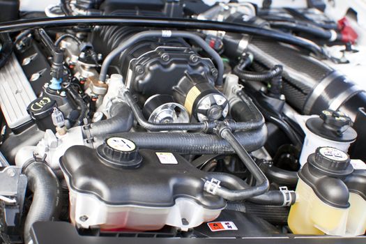 Car engine under the open hood