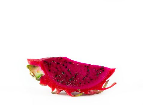 A piece of Healthy red dragon fruit against white background