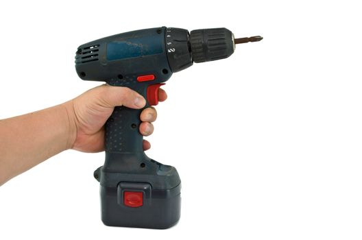 a hand holding a cordless drill with a cross head screw driver tip.