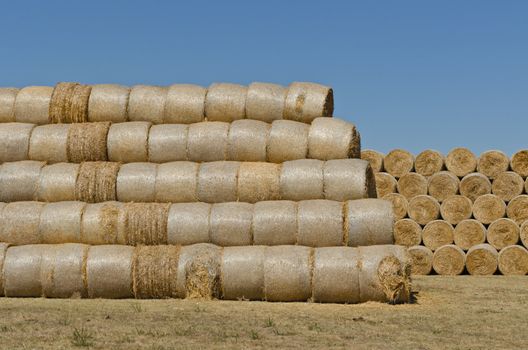 two big stacks of hay bales, horizontal shot