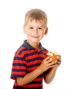 Boy holding an apple isolated on white background