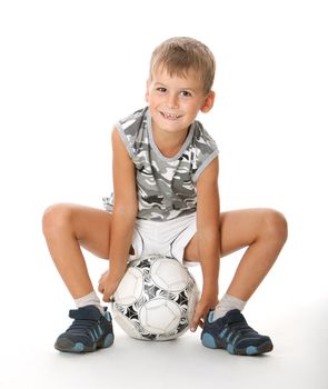 Boy holding soccer ball isolated on white background