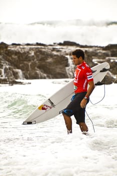 SNAPPER ROCKS, GOLD COAST, AUSTRALIA - FEB 26: Unidentified Surfer races the Quiksilver & Roxy Pro World Title Event. February 26, 2012, Snapper Rocks, Gold Coast, Australia