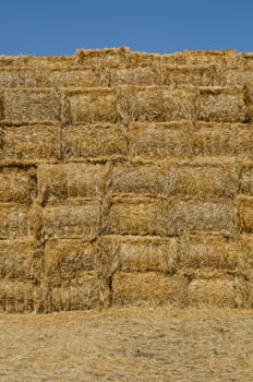 a stack of hay bales, vertical shot